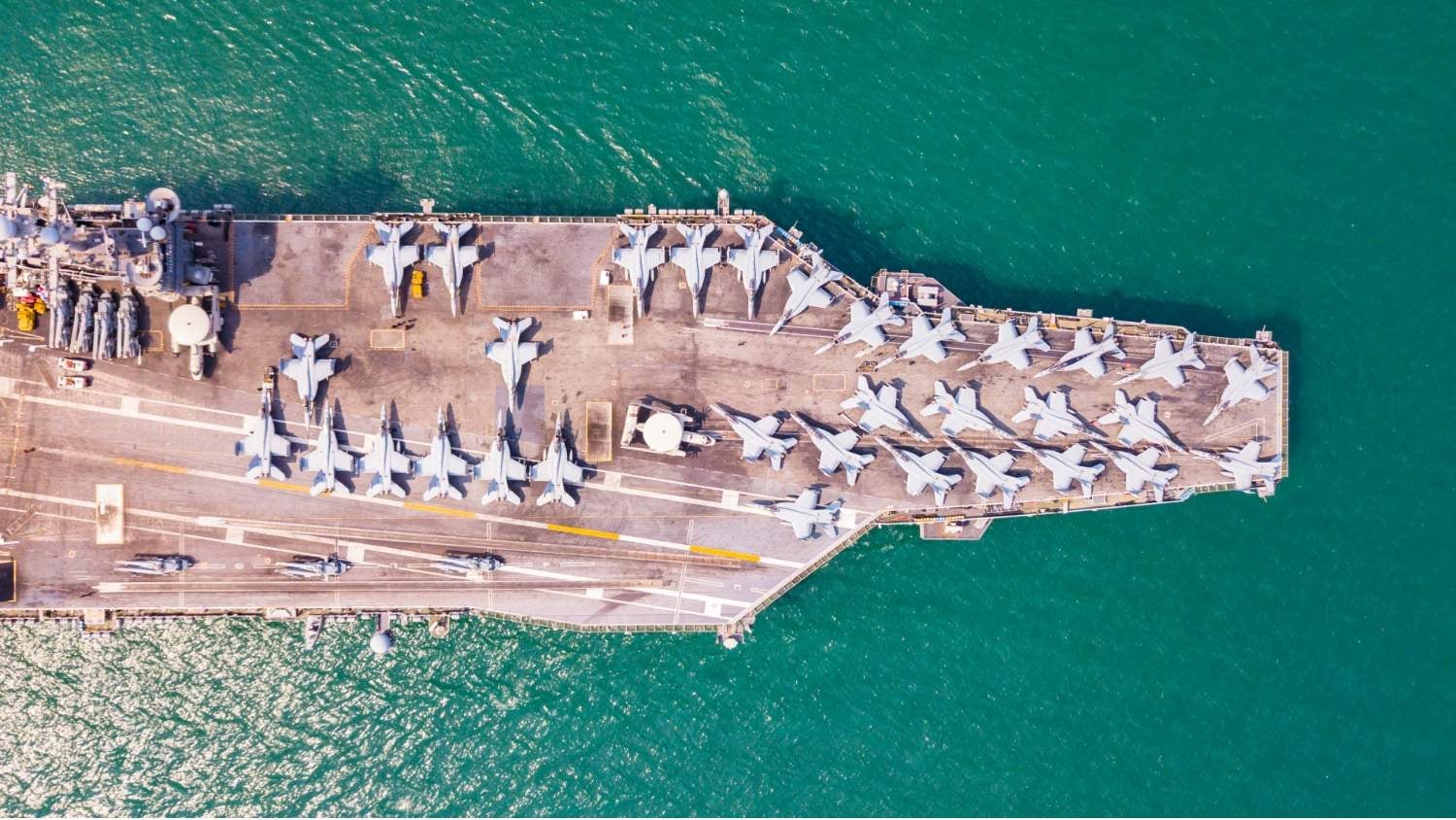 Overhead image of planes on a military ship