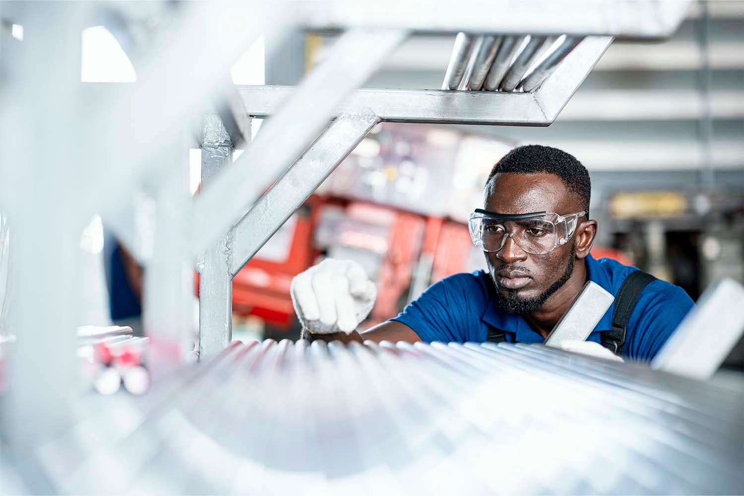 Industrial technician working at conveyor belt