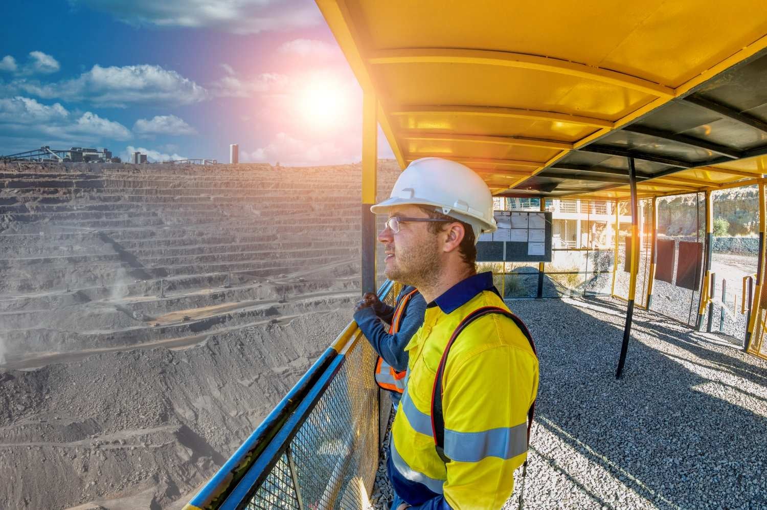 Industrial employee looking out over construction site