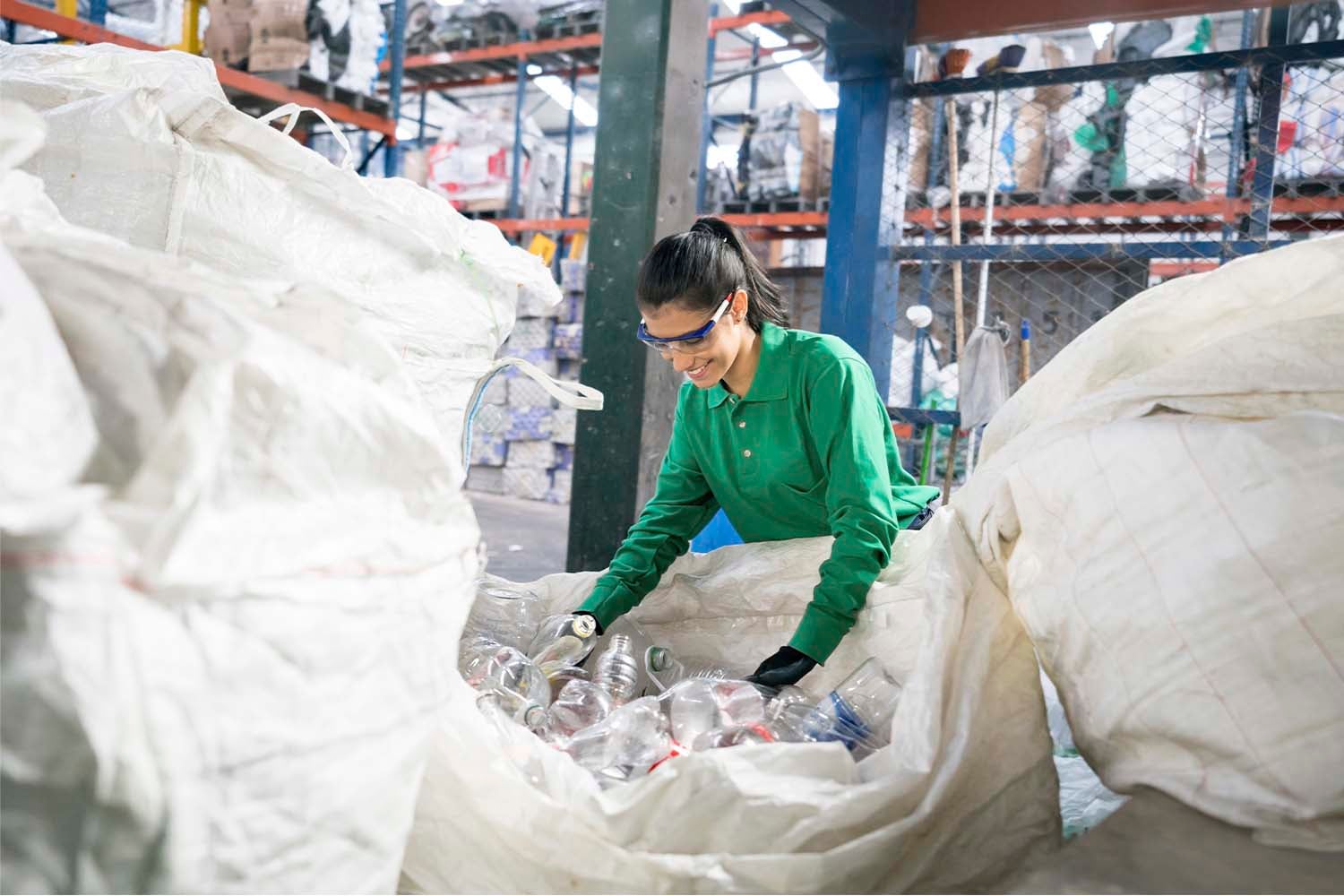 Smiling employee at a plastic recycling facility