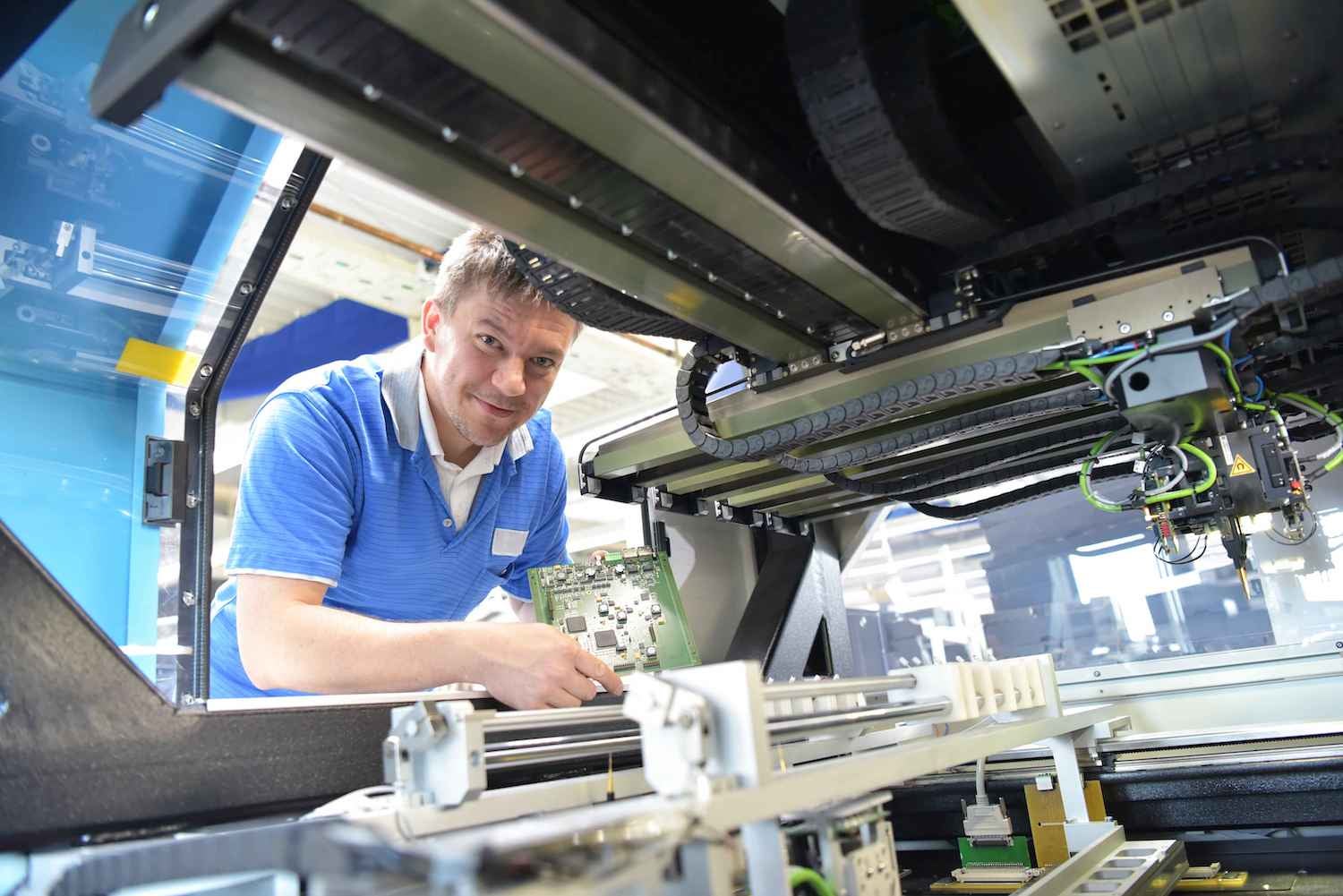 Technician working on motherboard production