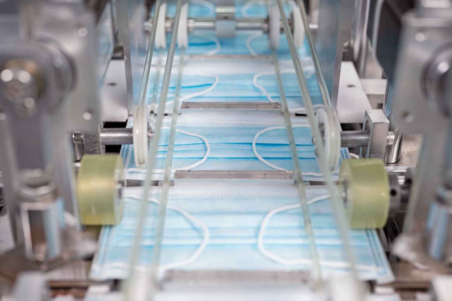 Close-up of surgical masks being produced