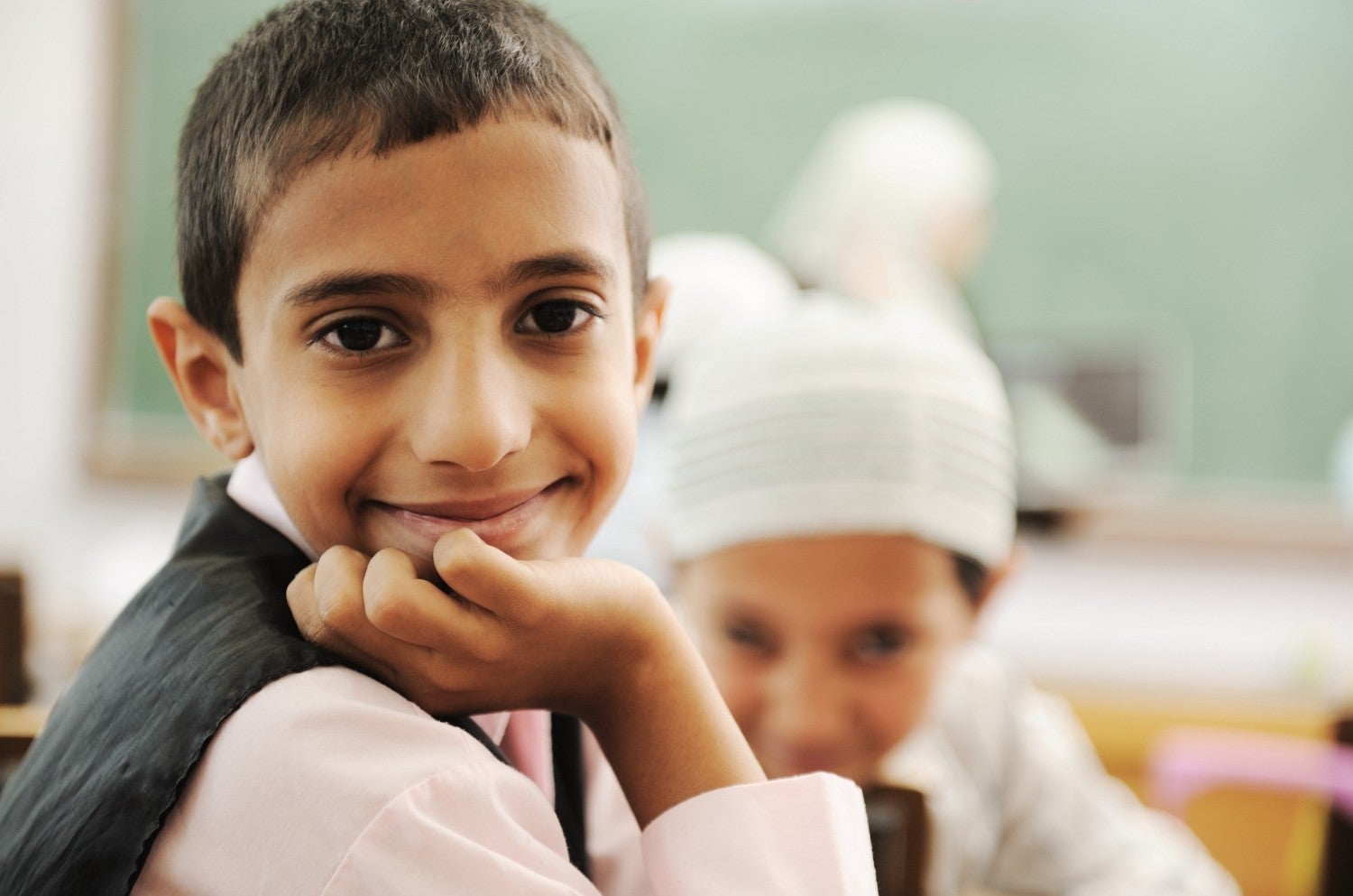 Smiling child in an academic setting