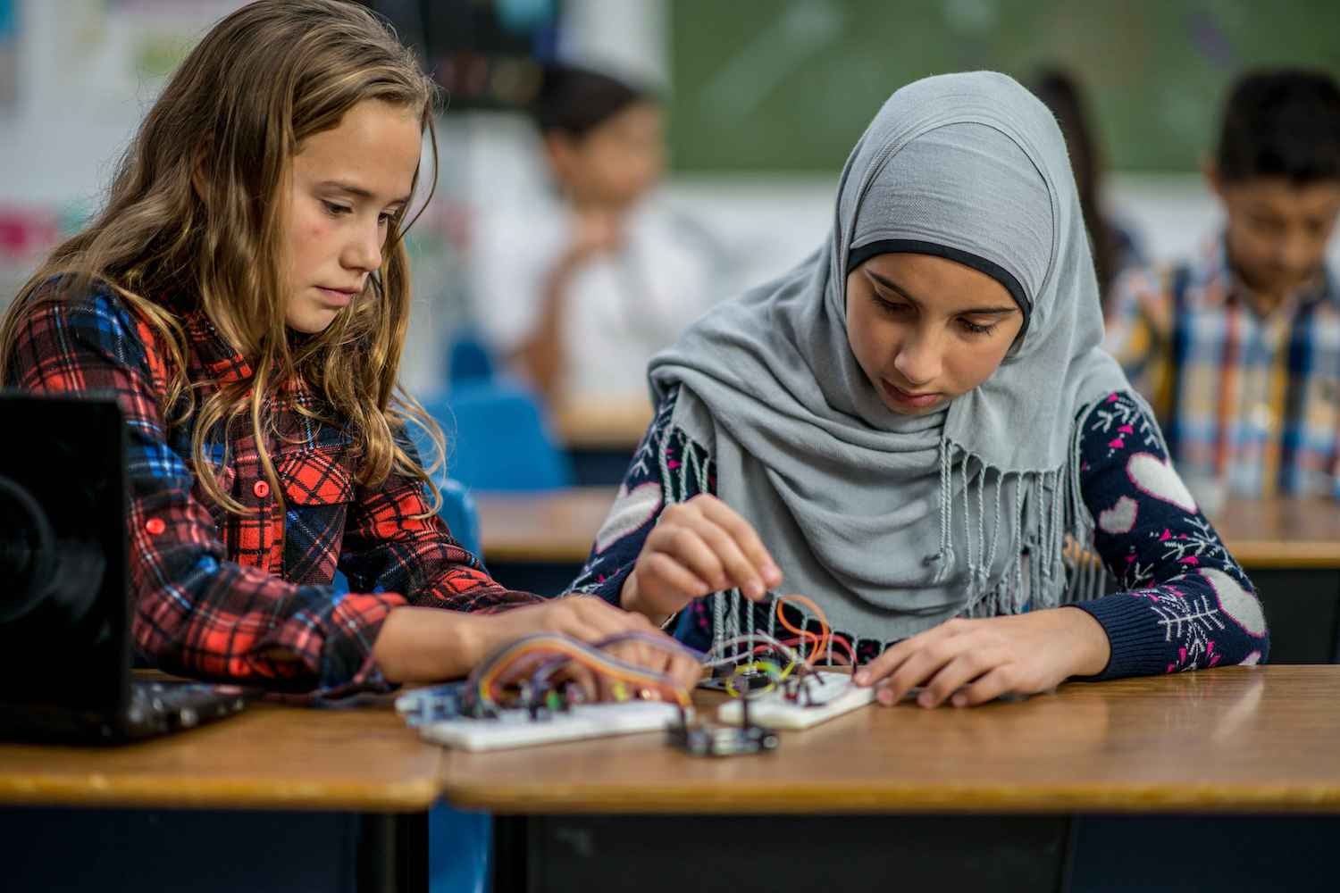 Image of two children working on an electrical project in a school setting