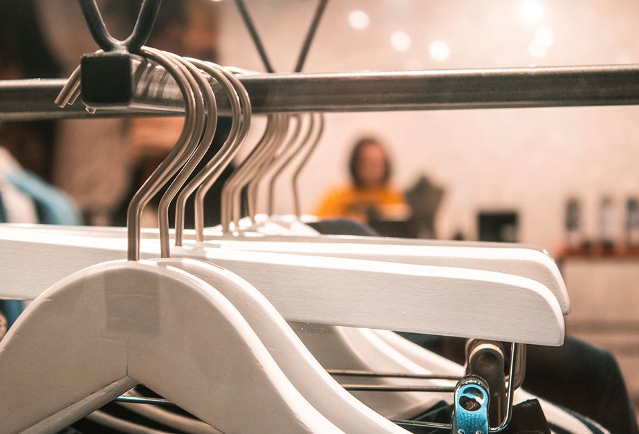 Close-up shot of clothes hangers in a retail environment