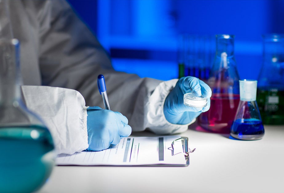 Researcher examining a medical specimen