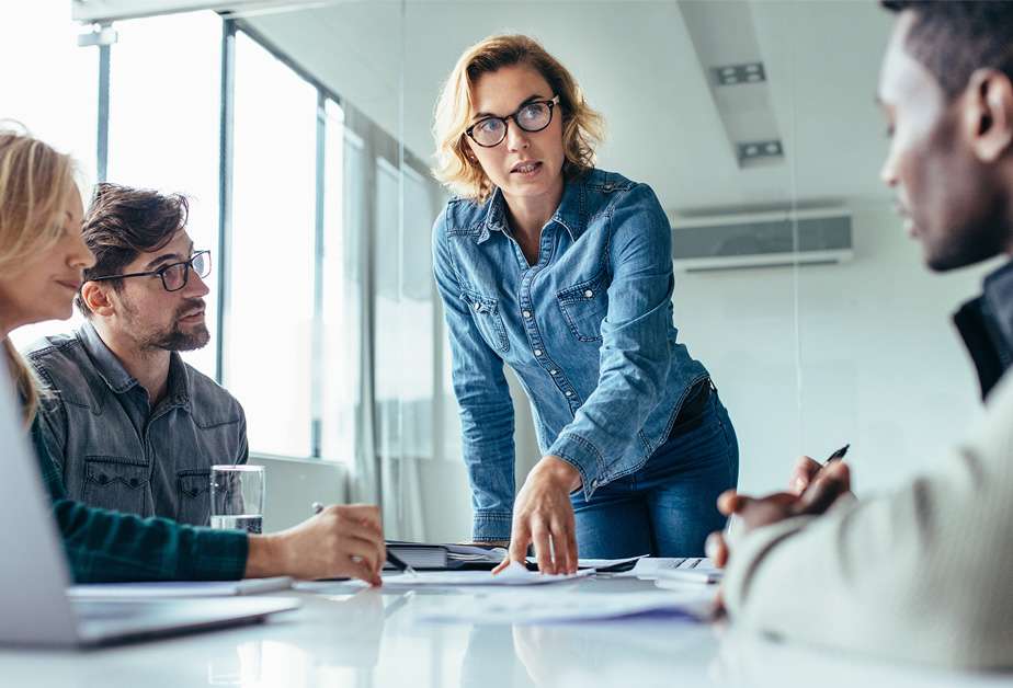 Female executive asking ESG solution questions during a meeting