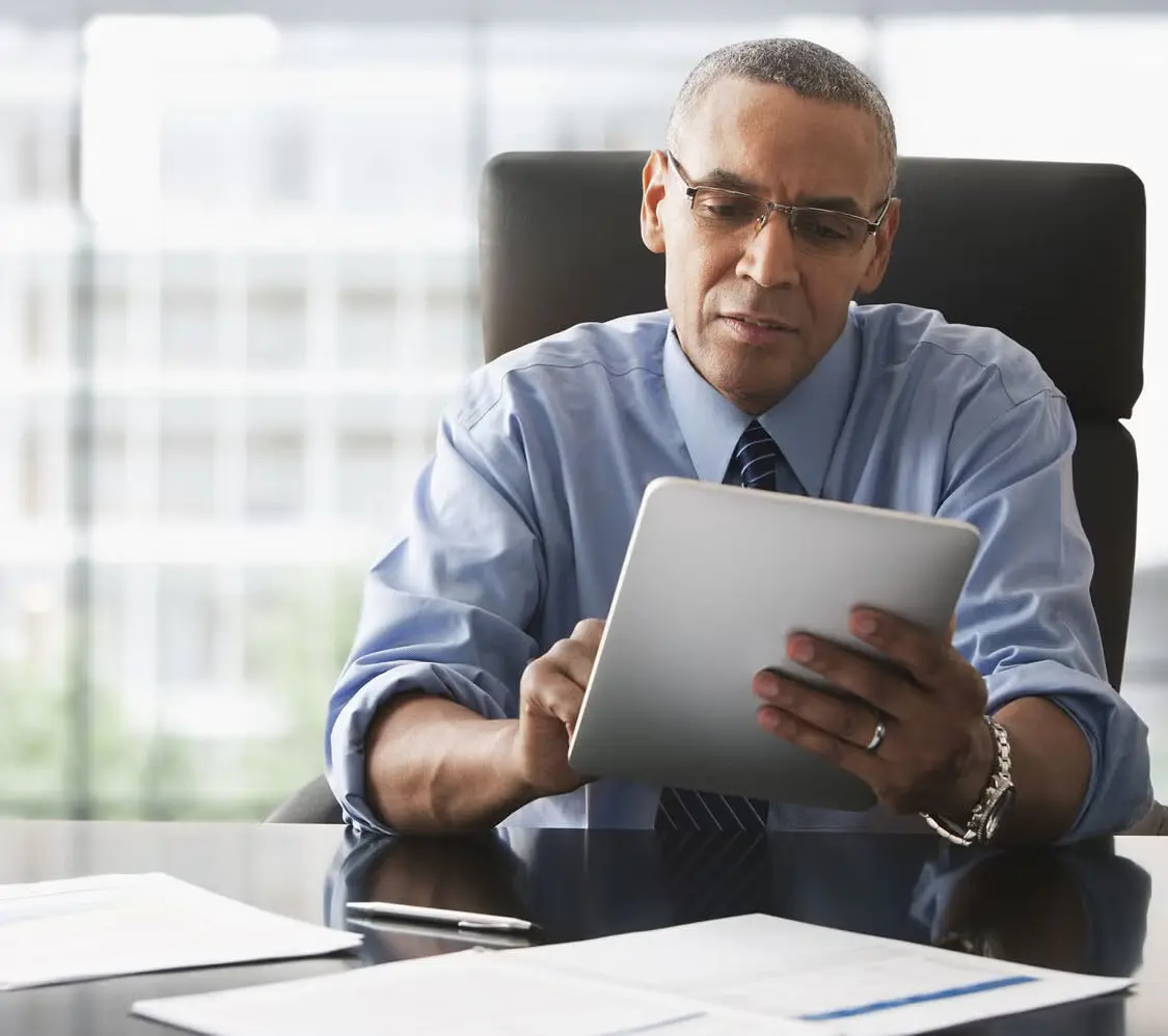 A manufacturing executive evaluating supply chai software vendors and looking concerned.