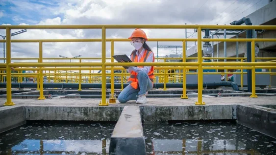 A woman testing water for PFAS compliance.