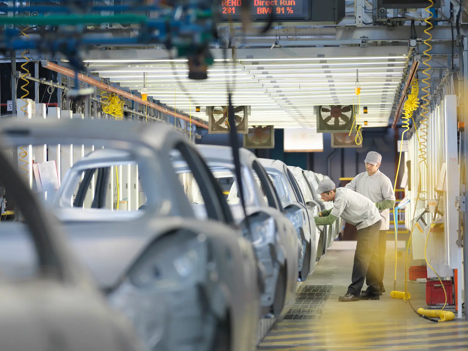 Cars on a production line representing a new DDRT supply chain due diligence standard.