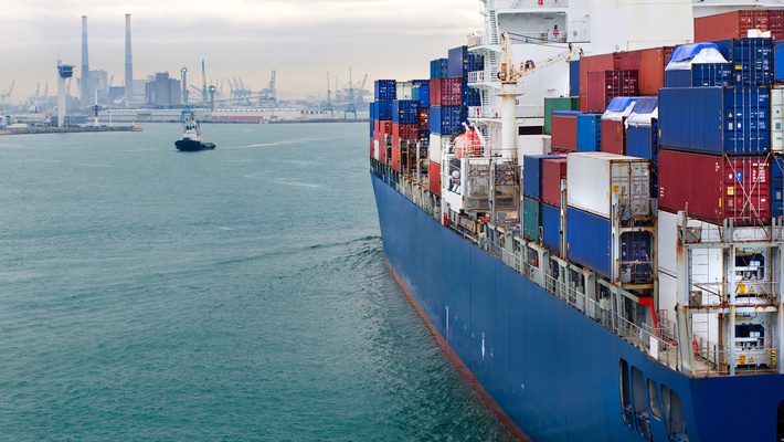Container ship at port representing global trade, country of origin documentation, and international trade compliance requirements.