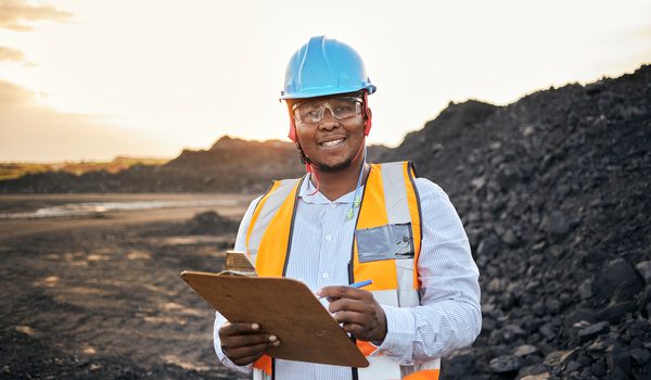 A man conducting an audit on a mine as part of responsible mineral sourcing.