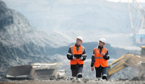 Inspectors reviewing a mining side for human rights in the supply chain.