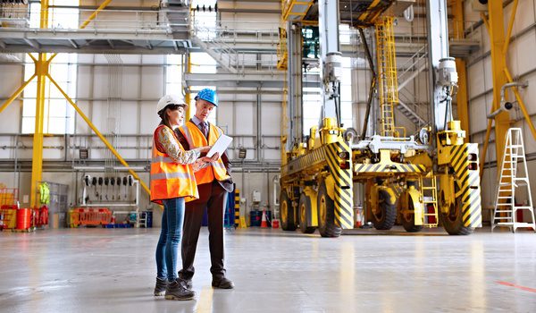 Two compliance professionals discussing how to engage suppliers.